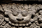 Prambanan - Candi Lara Jonggrang, makara figure as dwarapala at foot of the door 